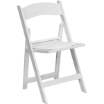 White padded chair rentals for garden wedding.